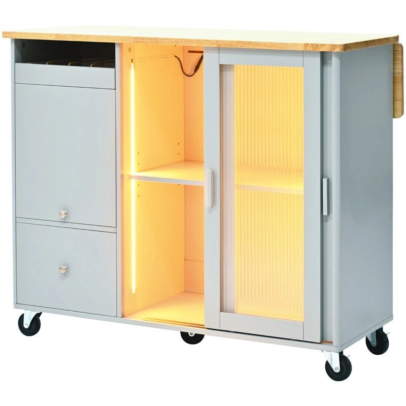 Desserte de cuisine à roulettes avec abattant, lumière LED, 2 portes vitrées cannelées et 1 porte d'armoire basculante.